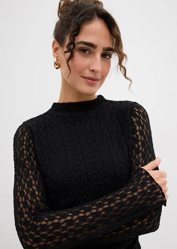 Spetsklänning med flikig nederkant, bonprix