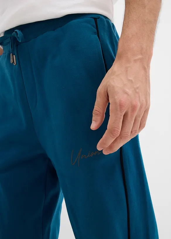 Sweatbyxa med kontrasterande detaljer av ren bomull, bonprix