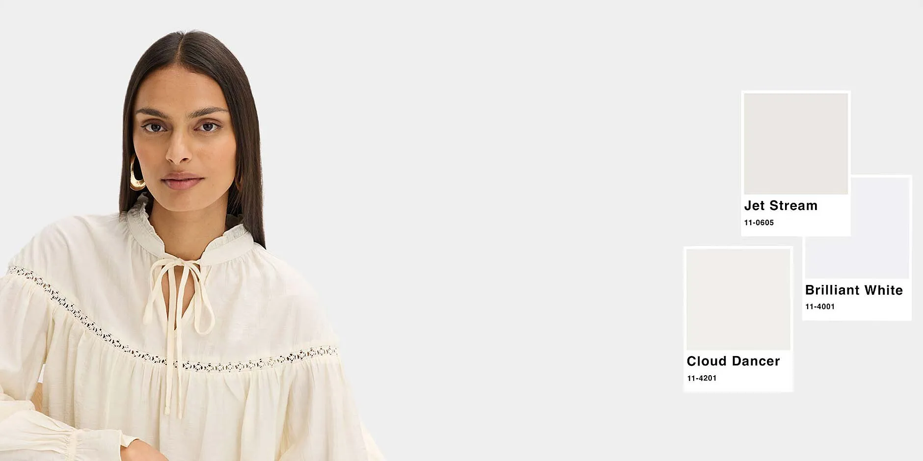 Elegant, cremevit blus med brodyr som matchar de visade vita nyanserna perfekt.