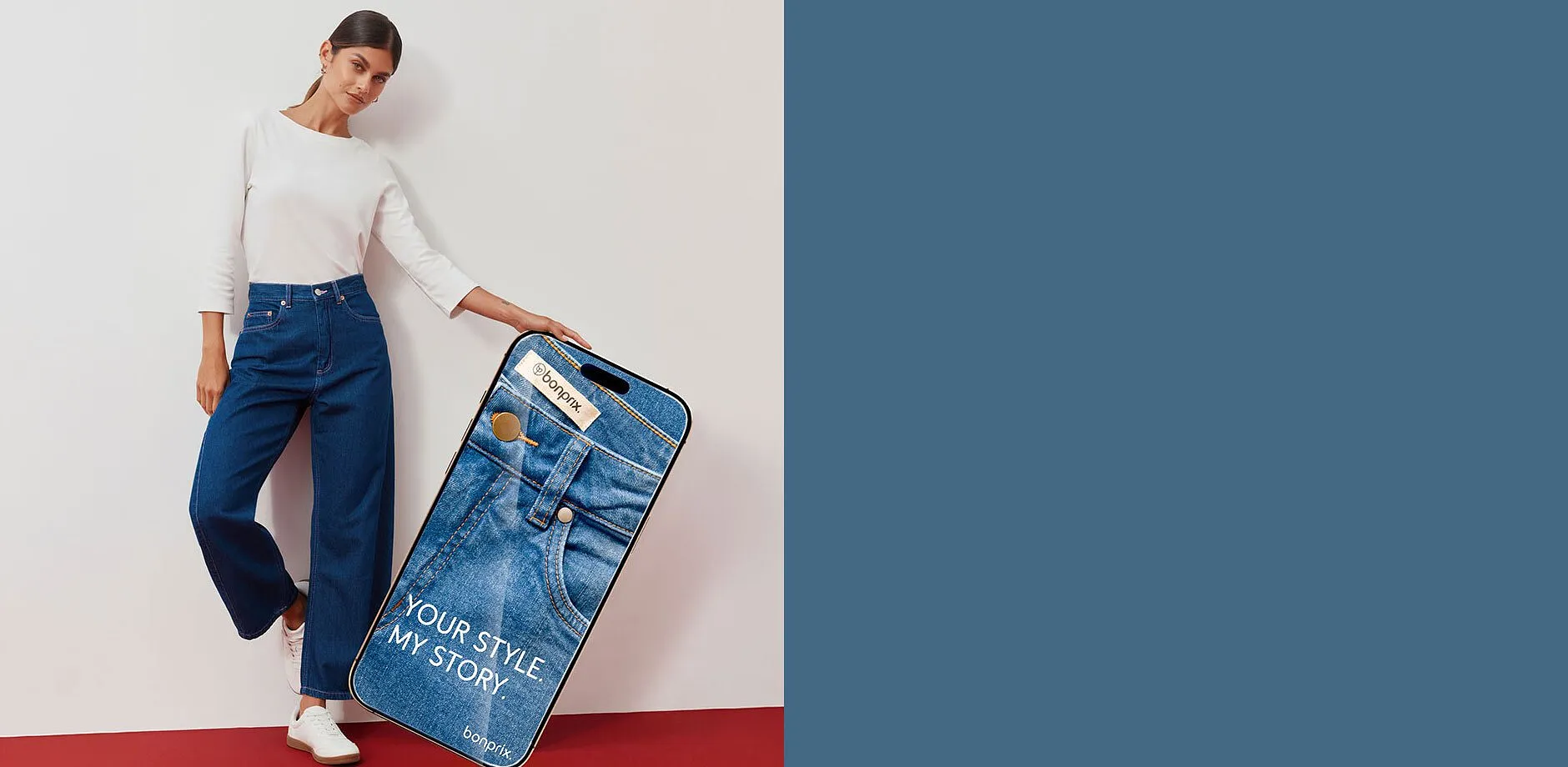 Vit &ouml;verdel, moderiktigt vida jeans och sneakers.