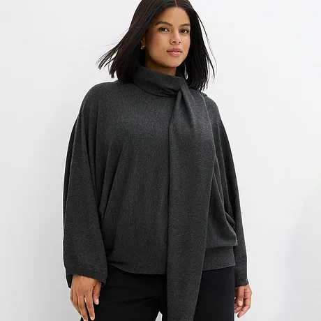 Elegant, mörkgrå tröja med hög krage.