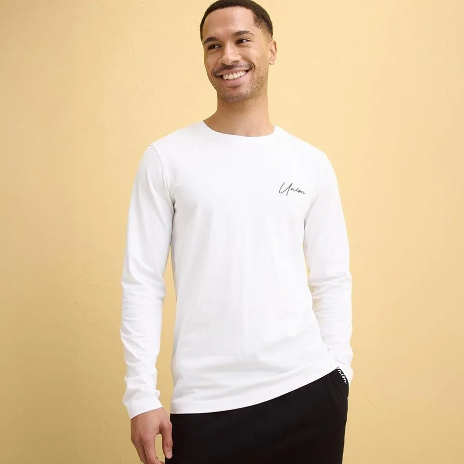 Vit l&aring;ng&auml;rmad tr&ouml;ja med rund halsringning.

