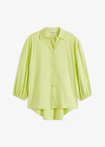 Blus med ballongärmar som är längre bak än fram