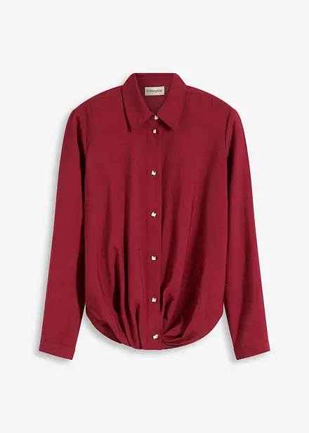 Blus med omlottdetalj av material med struktur