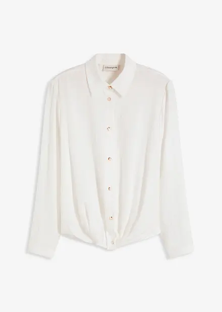 Blus med omlottdetalj av material med struktur