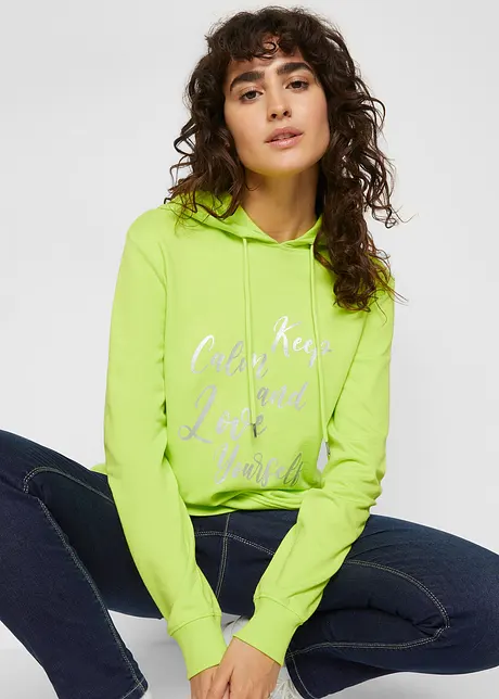 Sportig, feminin sweatshirt med metalliskt texttryck, sprund i sidorna för större rörelsefrihet samt huva, bonprix