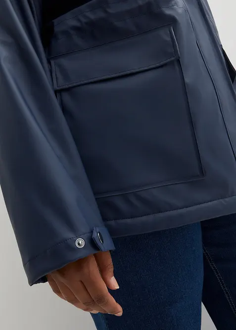 Regnjacka med teddyfoder gjord av ett vattentätt material, bonprix