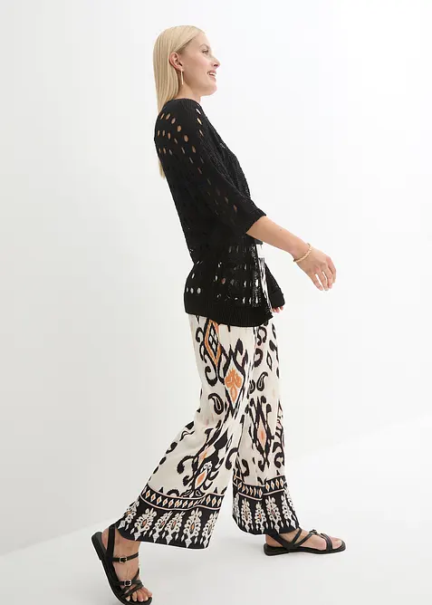 Hålmönstrad cardigan med glittrande tråd, bonprix