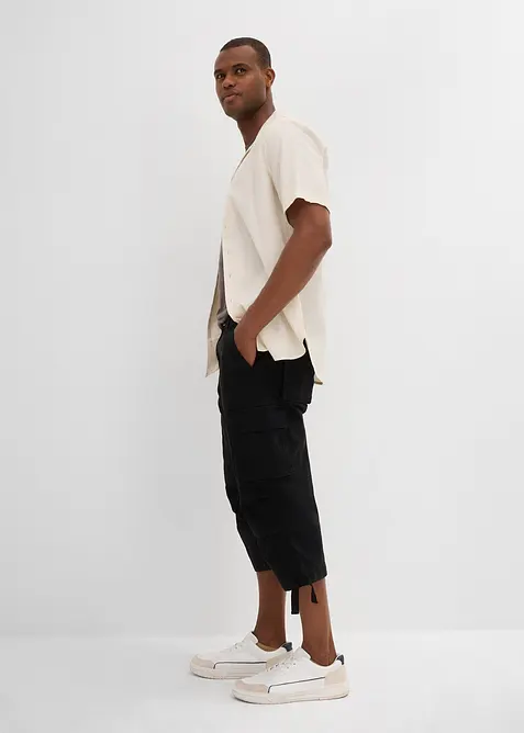 Stretchig cargobyxa med vida ben i 3/4-längd, Loose Fit, bonprix
