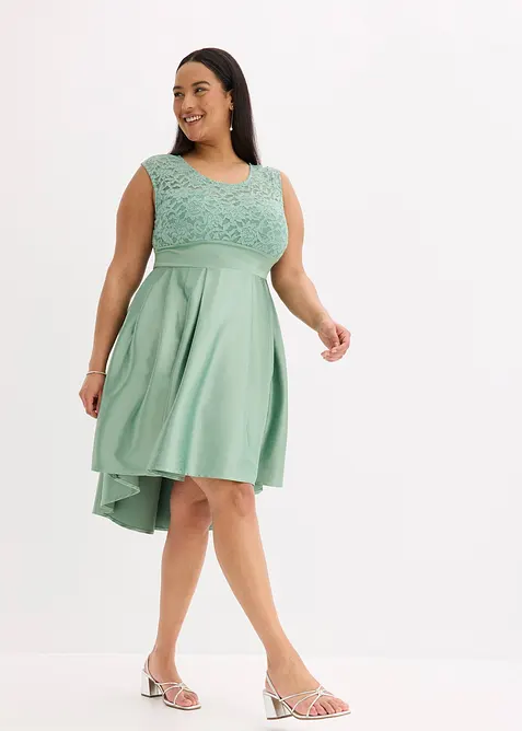 Klänning som är längre bak än fram i glänsande satin, bonprix