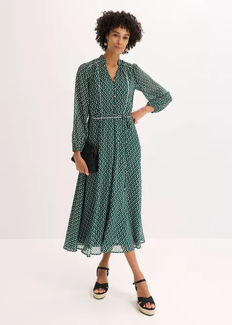 Mönstrad chiffongklänning med kontrasterande passpoaler, bonprix