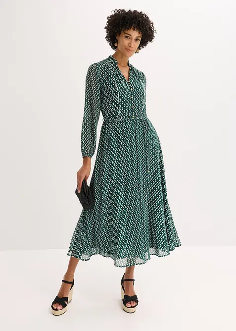 Mönstrad chiffongklänning med kontrasterande passpoaler, bonprix