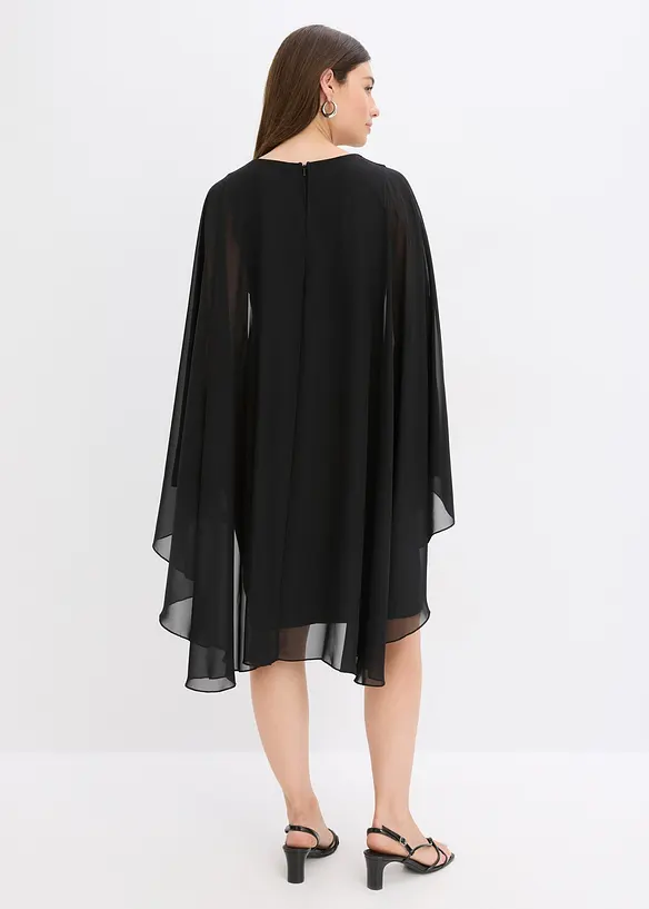 Miniklänning med cape av tunn chiffong, bonprix