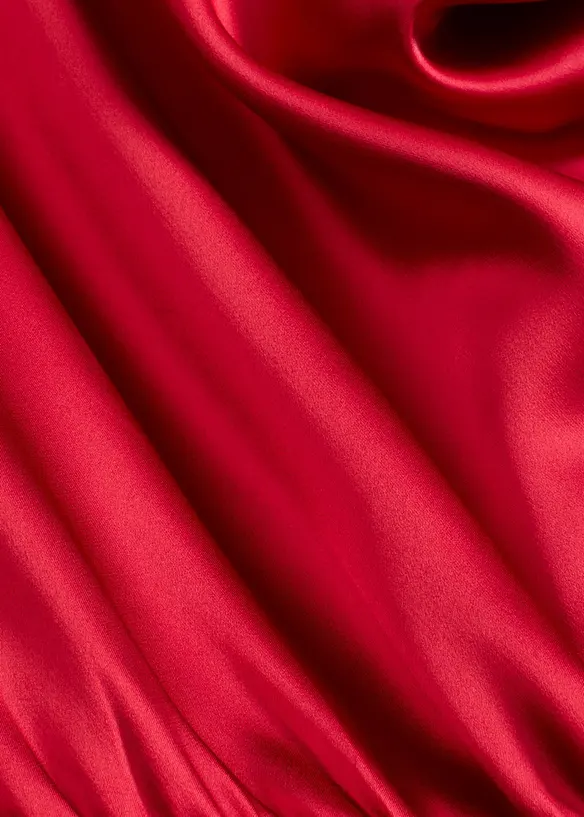 Mellanlång klänning i glansig satin, bonprix