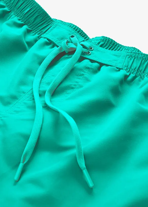 Badshorts med fickor i sidan, bonprix